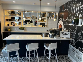 Stunning Italian Cafe Themed Studio Apartment Backing on a Canal